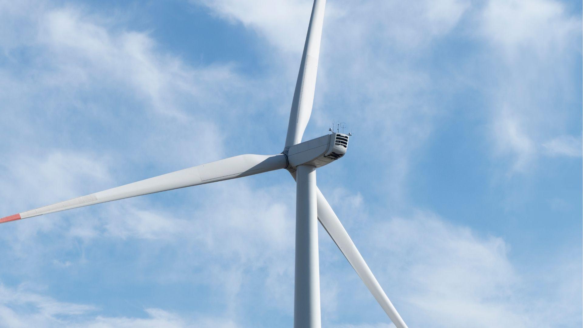 Wind turbine with red rips.