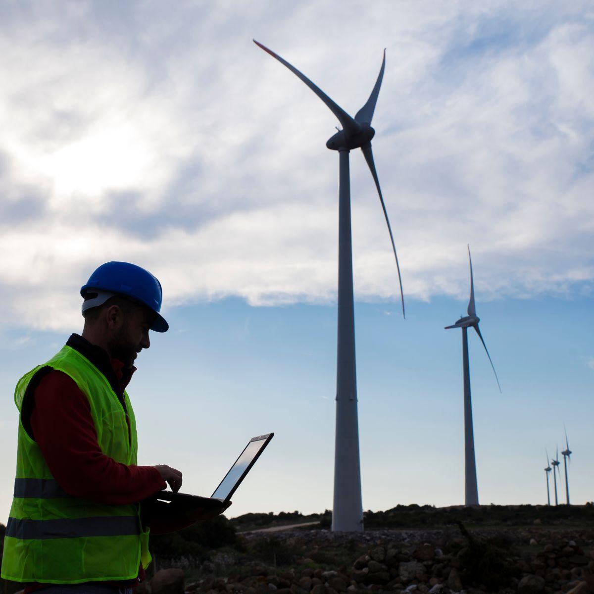 Engineer inspects wind turbines of imbalances.