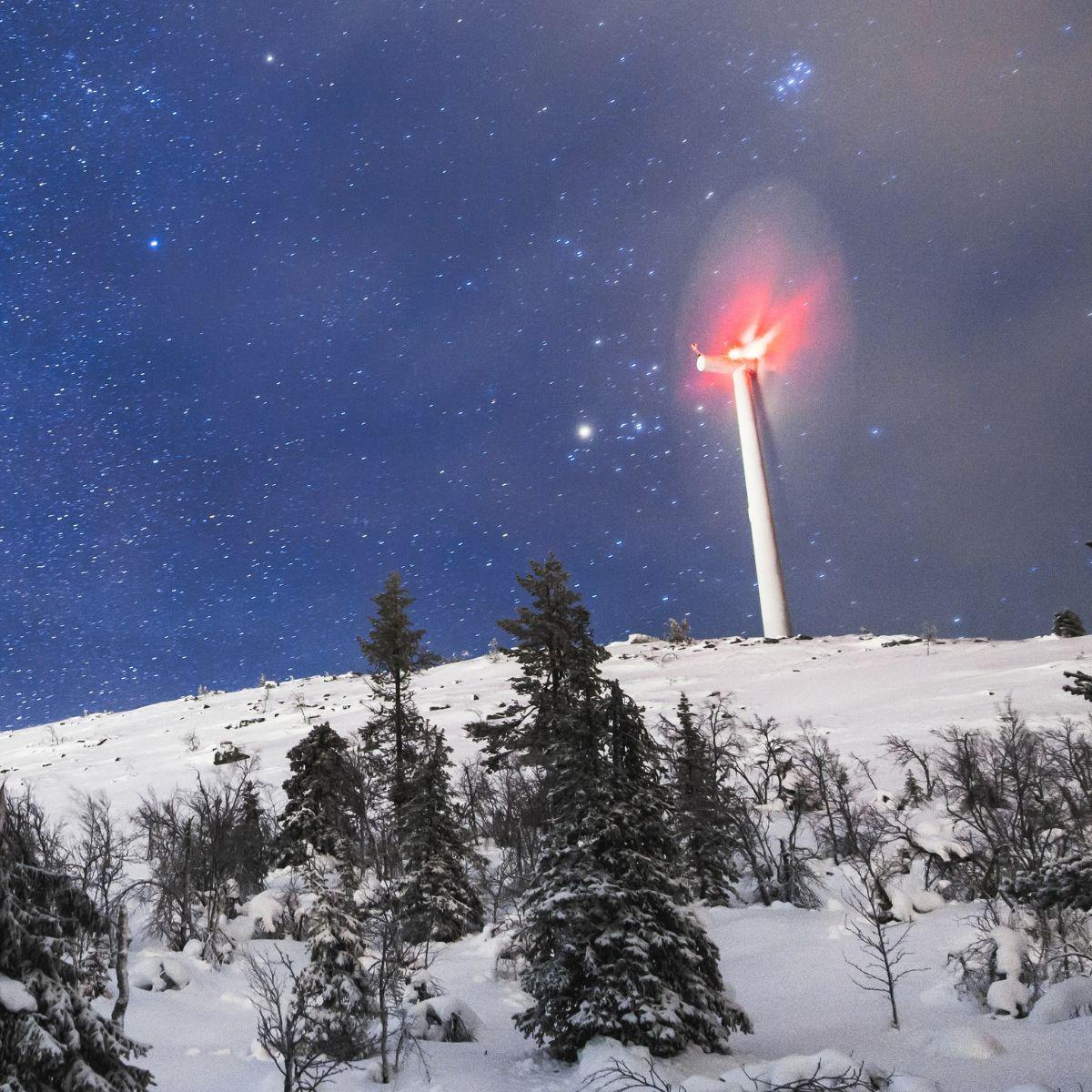 Wind turbine in winter by night.