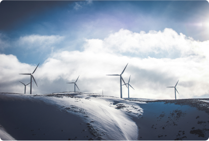 Eight wind turbines on a mointain covered with snow