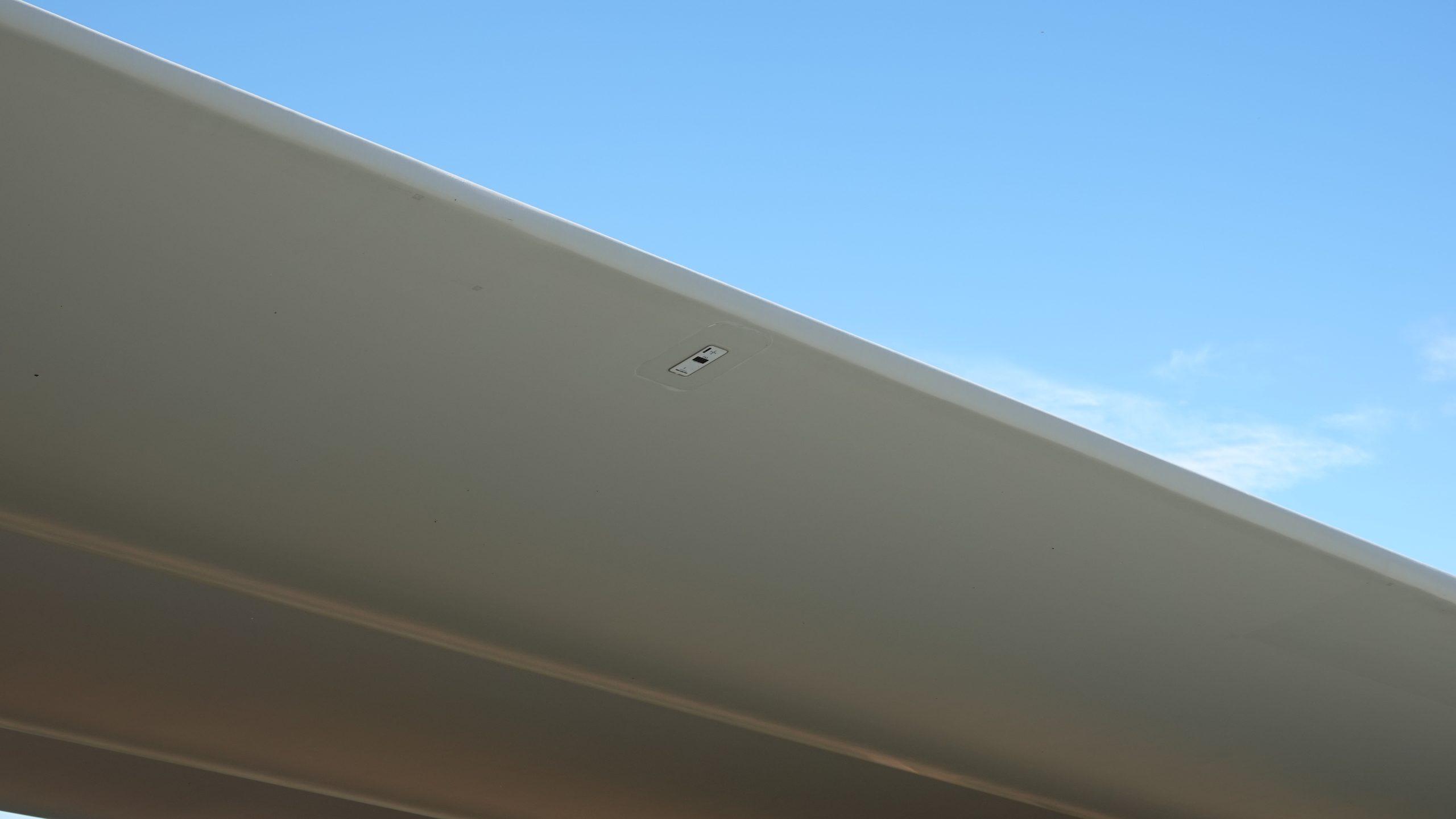 Wireless blade sensor mounted on the surface of a wind turbine rotor blade