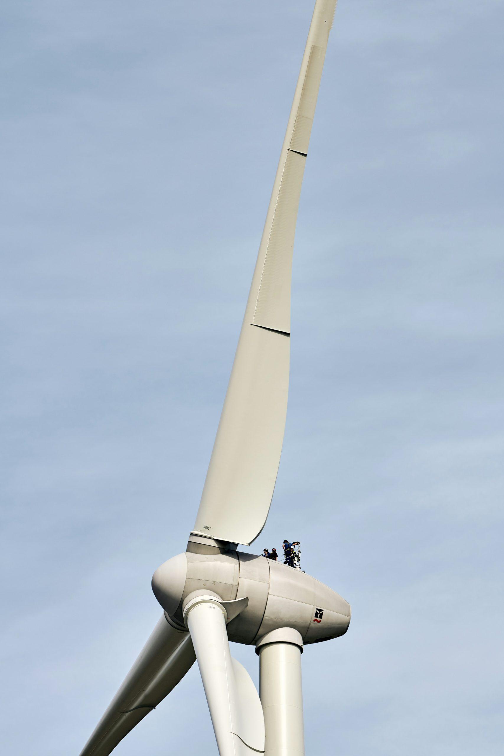 Wind turbine seen from below after an in-place rotor blade repair